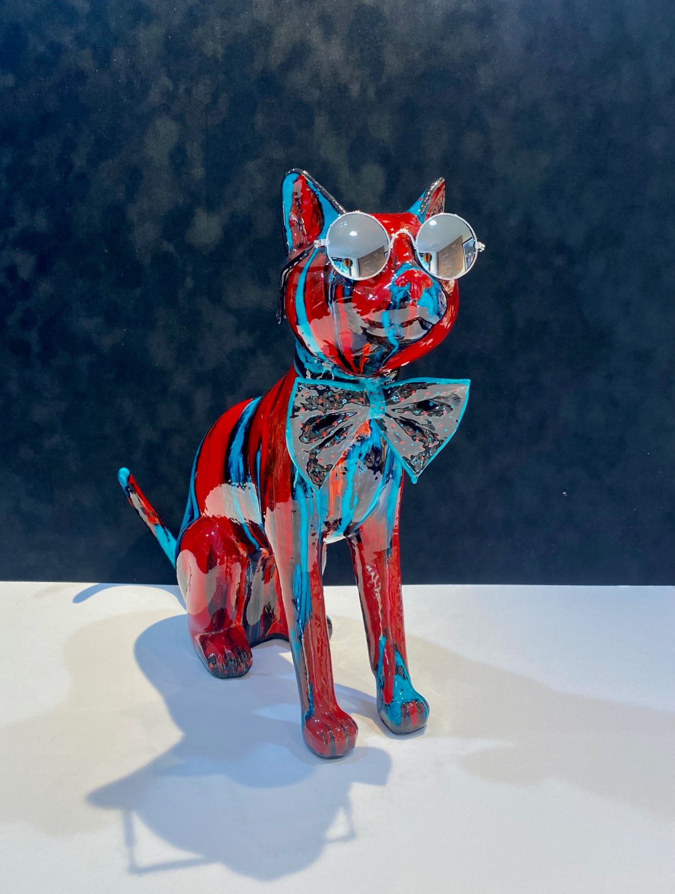 Ancizar Marin Sitting Cat with Glasses (Aqua and Red Swirl)